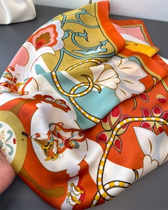 Detailed view of silk scarf with Dunhuang flying apsaras and floral pattern