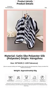 Close-up of zebra pattern satin silk scarf next to a pearl handbag and decorative items