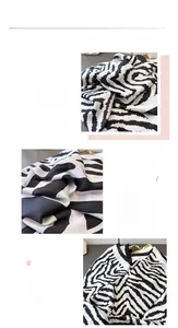 Macro detail of zebra print imitation silk scarf showing fine texture and hemmed edges