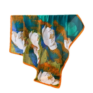 Elegant white lotus print silk-feel square scarf with dark green base and orange borders
