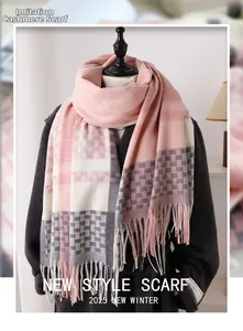 Detailed view of pink and grey plaid imitation cashmere scarf with soft tassel edges