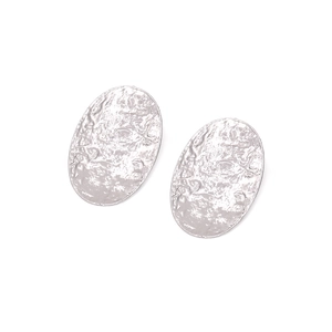 Detailed view of silver oval earrings with unique hammered texture and vintage finish