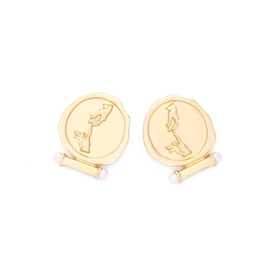 Close-up of vintage relief medal earrings with God's hand design and pearl accents