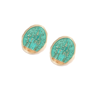 Vintage oval forest star earrings with green enamel and gold pine trees on white background