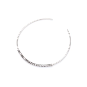 Minimalist silver metal circular necklace featuring a unique spring coil accent design