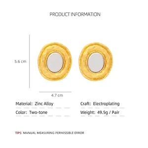 Minimalist oval mixed-metal geometric stud earrings with gold and silver two-tone texture