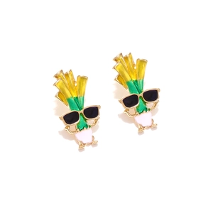 Macro detail of quirky enamel leek earrings with sunglasses in cartoon style