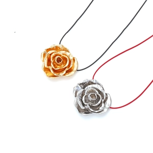 Artistic metal rose necklaces in gold and silver with red and black cords