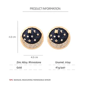 Star and moon planet drop earrings in gold alloy with blue enamel and rhinestones