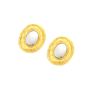 Detail of gold hammered texture and silver oval inlay on modern geometric earrings