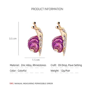 Cute snail earrings with purple enamel and white rhinestones in gold alloy finish