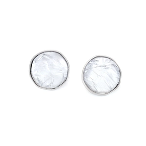 Detail of silver irregular round stud earrings with white textured resin inlay and minimalist art