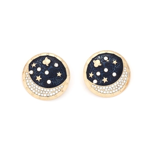 Round gold stud earrings featuring deep blue enamel night sky with moon and star design