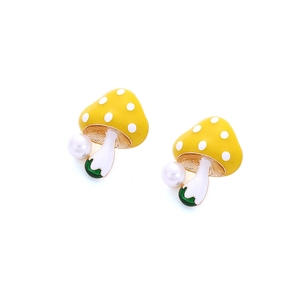 Cute yellow enamel mushroom earrings with faux pearls on a minimalist white background