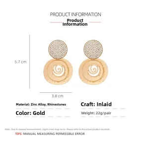 Detail view of gold vintage spiral hoop earrings with rhinestones measuring 5.7x3.8cm