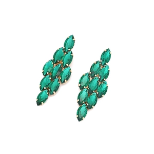 Detailed view of dark green marquise-cut crystal earrings with gold-tone alloy base
