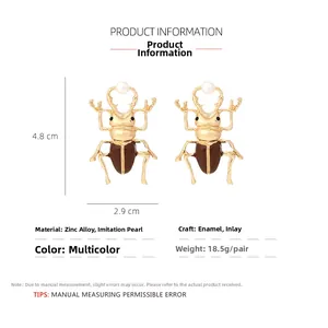 Detailed dimension view of gold alloy beetle earrings with brown enamel and pearls
