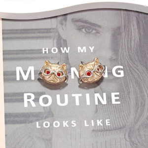 Chic cat stud earrings with glasses and red crystal accents in polished golden metal