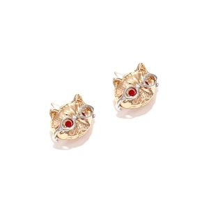 Macro detail of cat stud earrings featuring silver glasses and red gemstone eyes