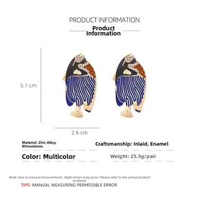 Detailed technical diagram showing tropical fish earring dimensions of 5.1cm by 2.6cm