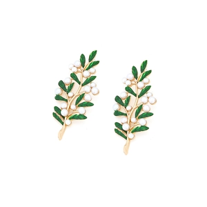 Elegant gold leaf earrings with green enamel and white imitation pearls on white background