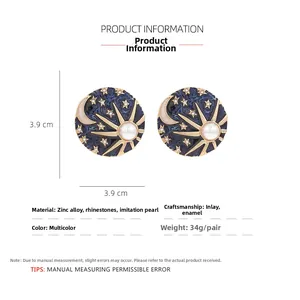 Detail view of 3.9cm vintage celestial earrings with sun moon motifs and rhinestones