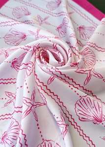 Detailed close-up of shell and starfish silk scarf fabric showing texture and luster
