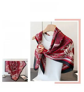 Macro detail of French vintage red and black floral satin scarf with fine edge stitching