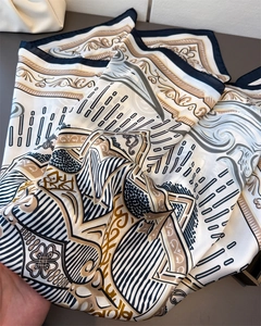 Detail of satin floral silk scarf showing baroque patterns and elegant drape texture