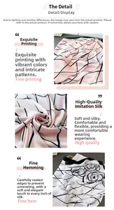 Detail of pink and black floral satin scarf featuring geometric prints and fine hem edges