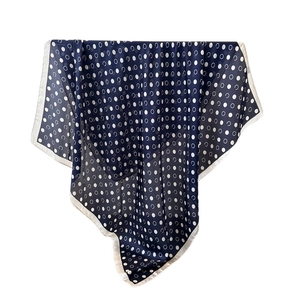Navy blue faux silk scarf with geometric polka dot pattern and white border