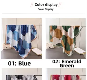 Detail of elegant floral satin scarves in blue and emerald with high-quality silk sheen