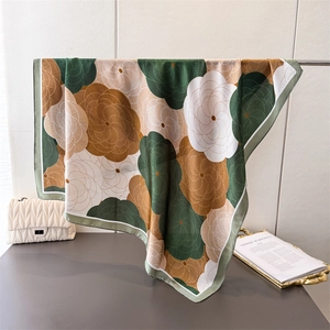 Elegant floral satin silk square scarf with abstract swirl pattern in vintage green and caramel