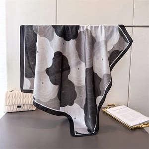 Elegant floral satin silk scarf with black camellia print and wide border detail