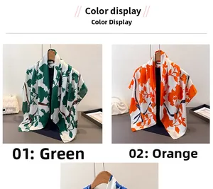Detailansicht der quadratischen Satin-Halstücher mit Blumenmuster in Grün und Orange