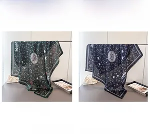 Detail view of ethnic mandala print satin scarves in green and navy blue colors