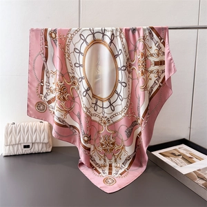 Luxurious chain print satin square scarf with baroque patterns draped elegantly