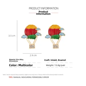 Detail view of colorful enamel hot air balloon earrings with size and weight specs