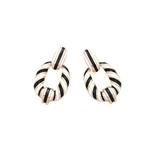 Luxury geometric oval drop earrings with black and white enamel zebra stripes in gold