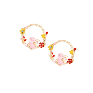 Detail of bunny and floral wreath earrings with pink enamel, pearls, and gold finish
