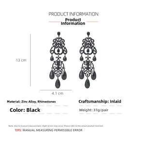 Detail shot showing 13cm length and 4.1cm width of black vintage drop tassel earrings