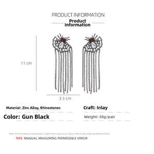 Detailed view of punk spider tassel earrings with sparkling rhinestones and gunmetal chains