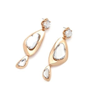 Detailed view of geometric drop earrings with gold metal frames and clear crystals