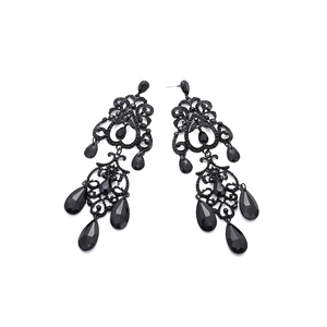 Vintage luxury black teardrop tassel earrings with intricate hollow alloy design
