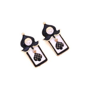 Quirky gold alloy card king earrings with black spades and cartoon doll face details