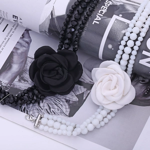 Handmade beaded multilayer necklace with a large fabric rose flower in black and white