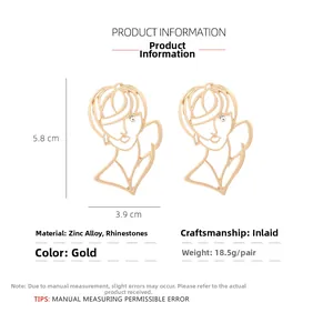 Détails des boucles d'oreilles visage abstrait doré avec strass, dimensions 5.8x3.9cm