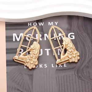 Artistic hollow cutout gold window earrings with a woman silhouette profile and curly hair