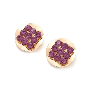 Close-up of gold geometric earrings with 3x3 square pattern of purple crystals