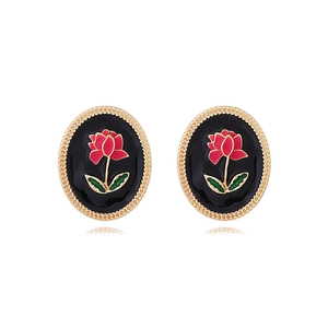 Vintage oval floral stud earrings with black enamel and red flower patterns on white background